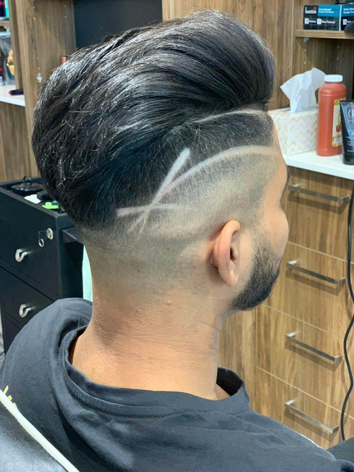 Pompadour with a razored hard part