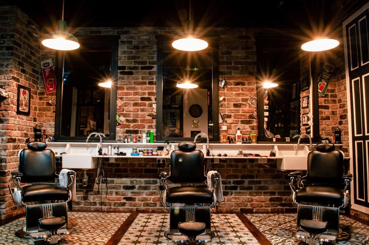 Alder & Steel concept — barbershop chairs and worn tools in tactile detail