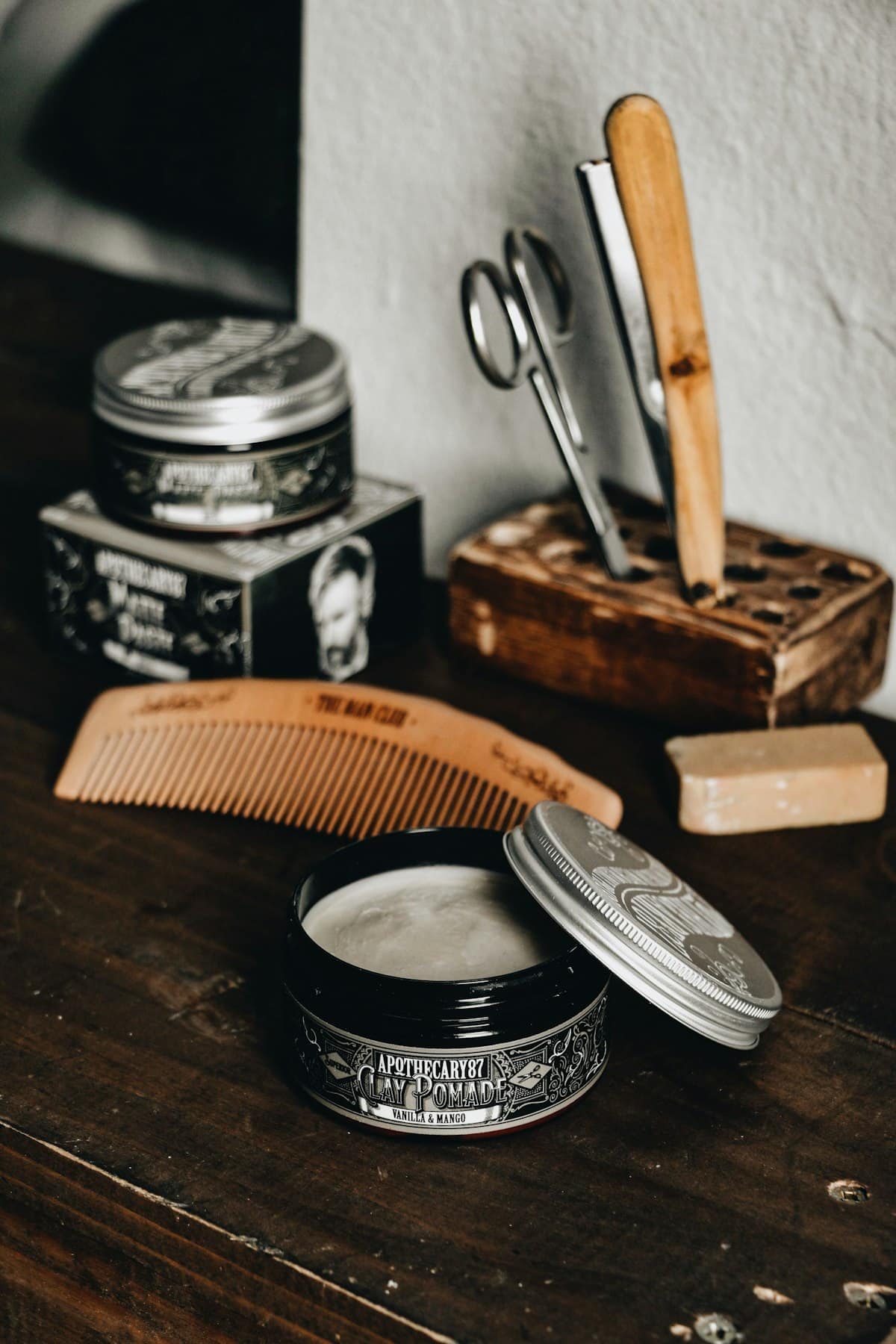 Combs, shears and pomade at the bench